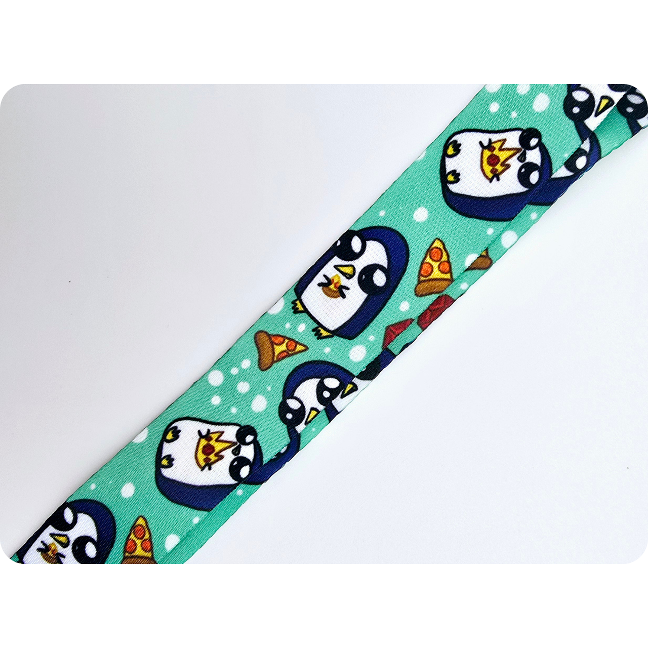 Penguin with pizza lanyard